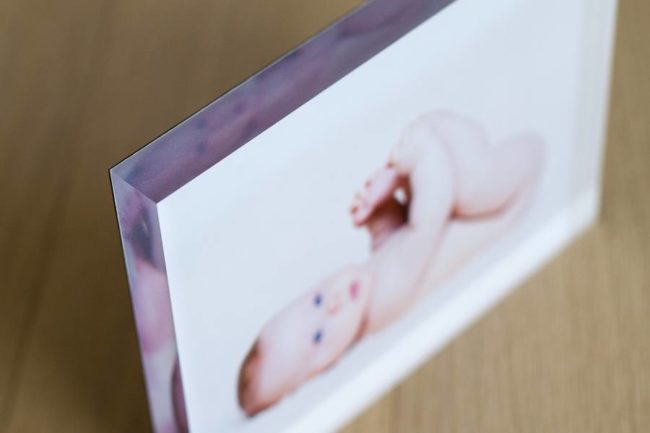 Edge of acrylic block with baby photo