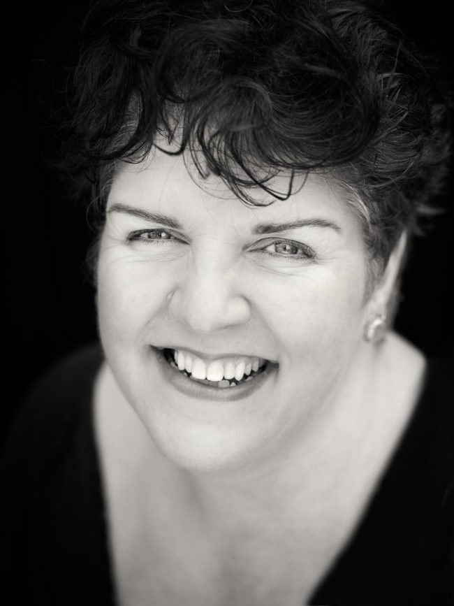 Black and white portrait of smiling woman