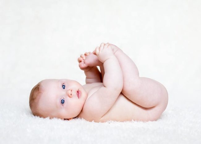 Baby holding his toes