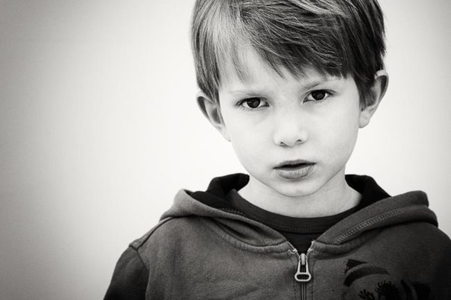 Serious boy portrait in black and white