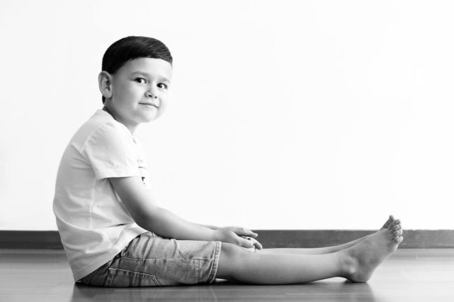 Boy sitting on the floor