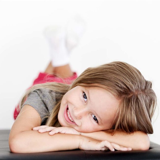 Girl laying on her hands