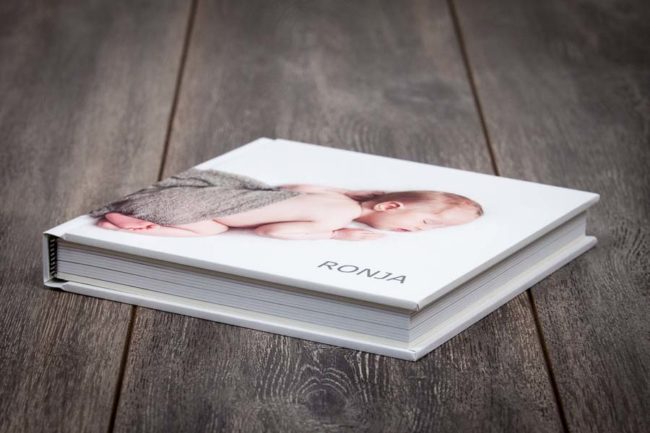 Portrait book with newborn